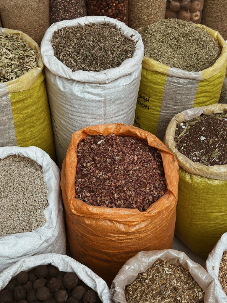 Bulk spices and pantry staples in woven warehouse sacks